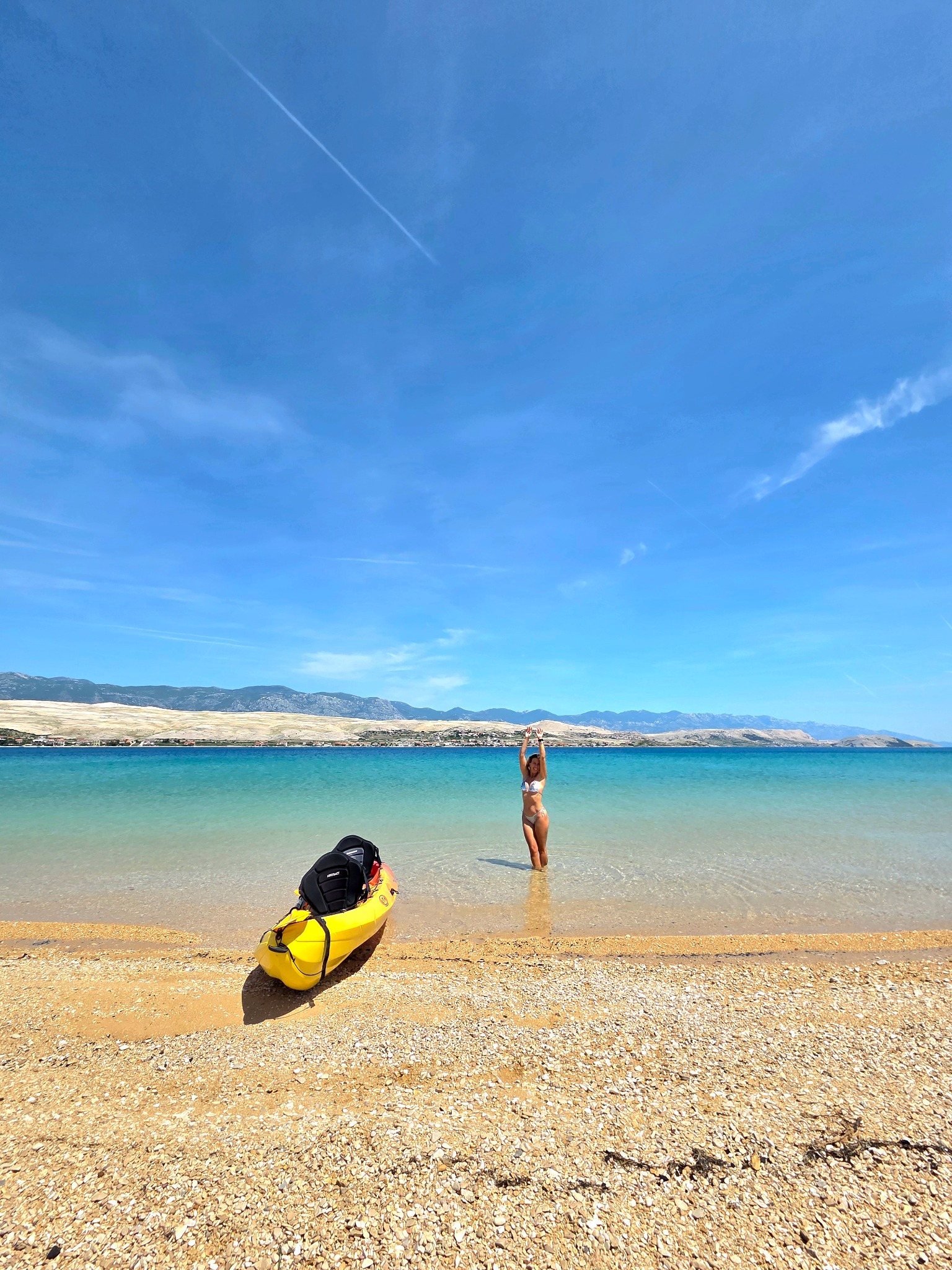 Kayak on a clear-water beach in Caska