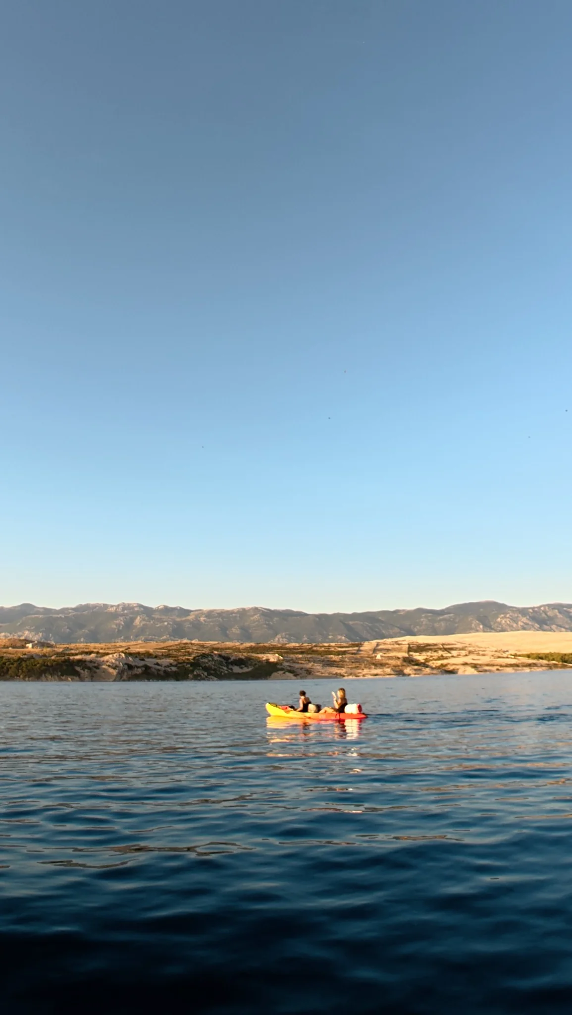Kayaks near navigation marker
