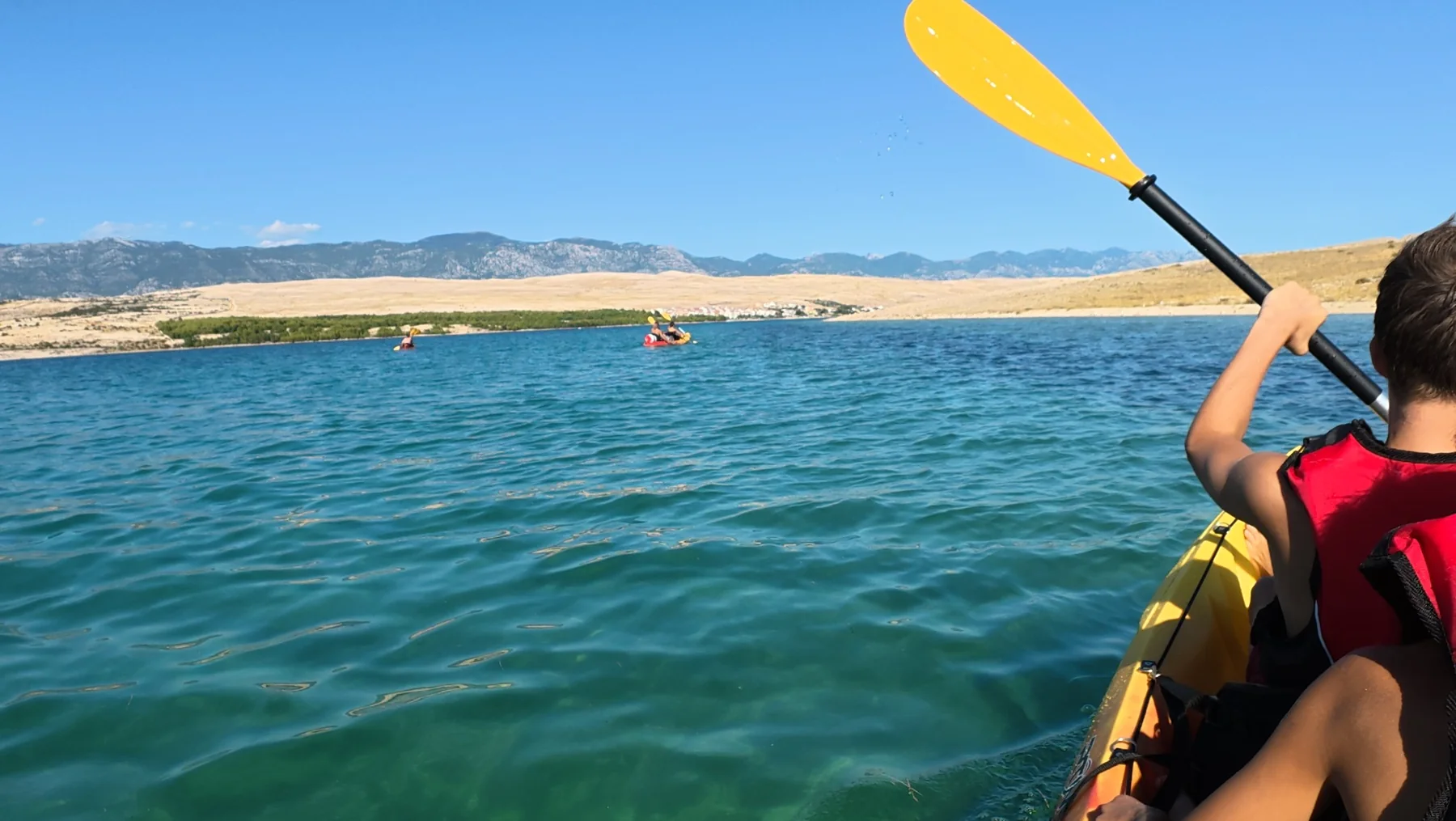 Paddling across Caska Bay
